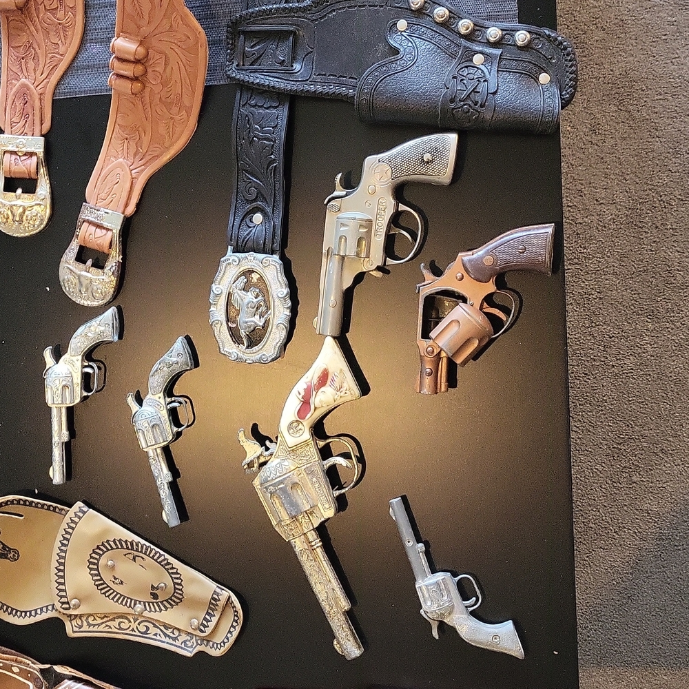 6 Toy Cap Guns, 3 holster belts, & 3 add to your own belt type holsters.
